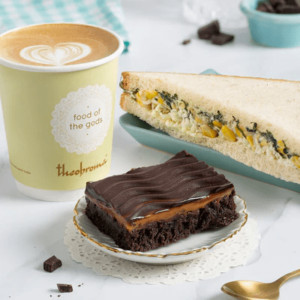 Choice of Beverage + Eggless Brownie + Veg Sandwich/Savoury/Nashik Delight Bakery